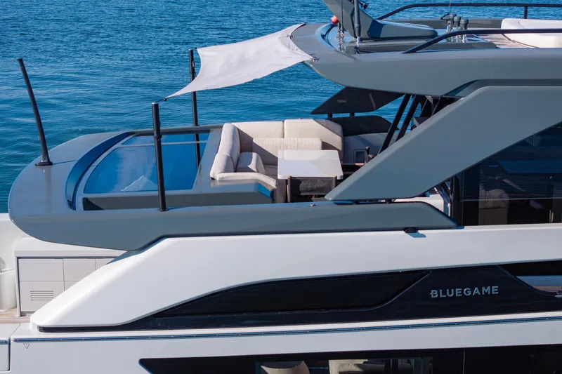 Slide: The Image of 2024 Bluegame BGX63 yacht with sleek design and luxurious seating area. - 26