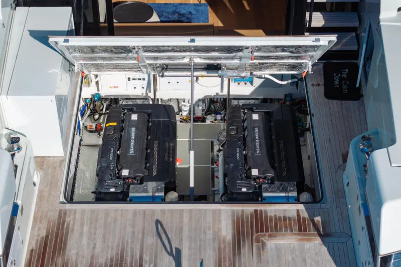 Slide: The Image of Engine compartment of 2024 Bluegame BGX63 yacht, featuring dual Volvo Penta engines. - 39