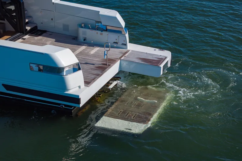 Slide: The Image of 2024 Bluegame BGX63 yacht with extended swim platform in water. - 41