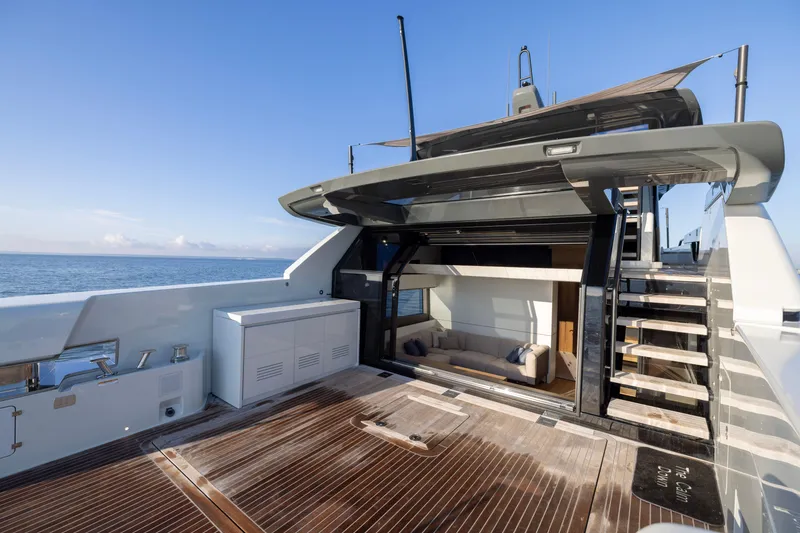 Slide: The Image of 2024 Bluegame BGX63 yacht deck with modern seating and ocean view. - 42