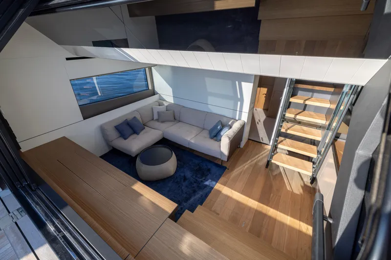 Slide: The Image of Luxurious interior of 2024 Bluegame BGX63 yacht with modern design and cozy seating area. - 47