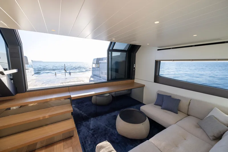 Slide: The Image of Luxurious interior of 2024 Bluegame BGX63 yacht with ocean view through large windows. - 49