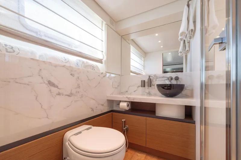 Slide: The Image of Luxurious bathroom in 2024 Bluegame BGX63 yacht with marble accents and modern fixtures. - 57