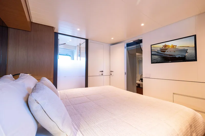 Slide: The Image of Luxurious interior of 2024 Bluegame BGX63 yacht bedroom with modern decor and amenities. - 61