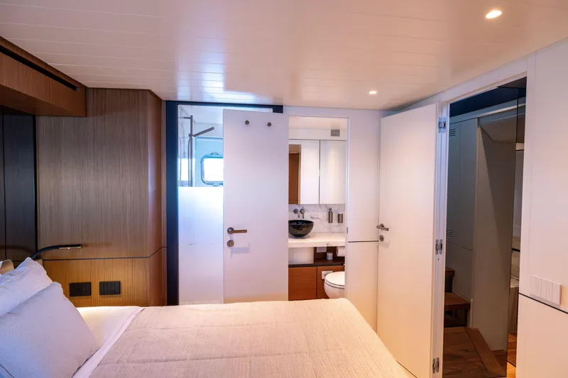 Slide: The Image of Luxurious interior of 2024 Bluegame BGX63 yacht featuring a modern bedroom and bathroom. - 62