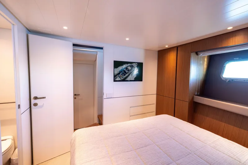 Slide: The Image of Luxurious cabin interior of 2024 Bluegame BGX63 yacht with modern design and window view. - 63