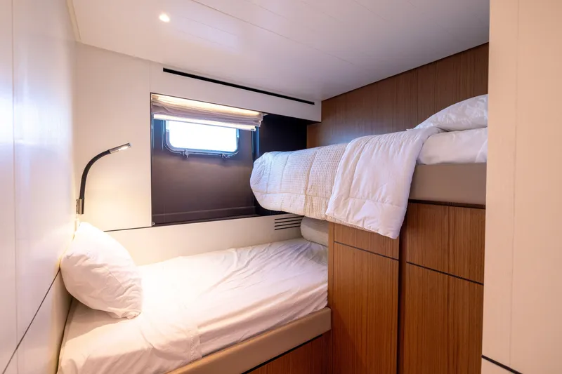Slide: The Image of 2024 Bluegame BGX63 yacht cabin with bunk beds and modern design. - 66