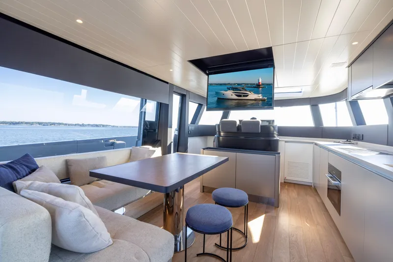 Slide: The Image of Luxurious interior of 2024 Bluegame BGX63 yacht with modern kitchen and seating area. - 68