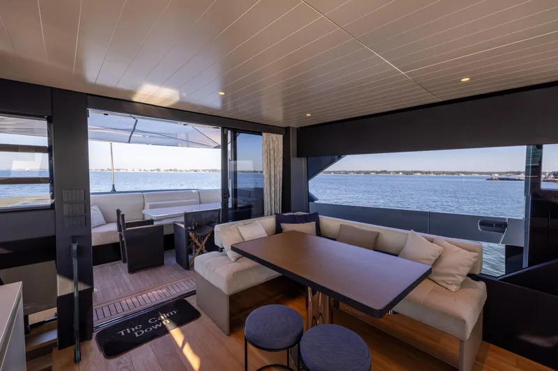 Slide: The Image of Luxurious interior of 2024 Bluegame BGX63 yacht with ocean view and modern seating area. - 71