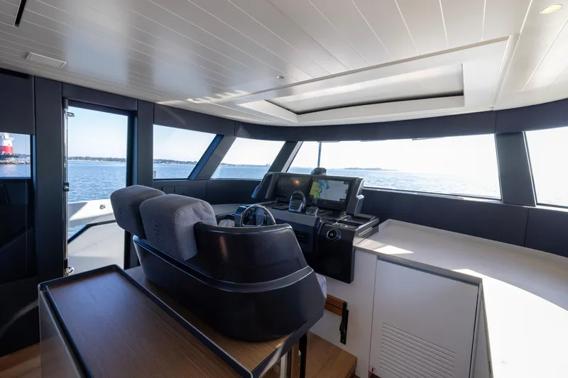 Slide: The Image of Interior view of 2024 Bluegame BGX63 yacht cockpit with navigation equipment. - 73