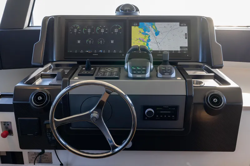 Slide: The Image of 2024 Bluegame BGX63 yacht helm with advanced navigation and control systems. - 75
