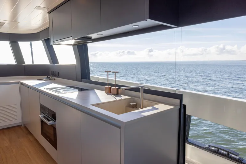 Slide: The Image of Modern kitchen interior on 2024 Bluegame BGX63 yacht with ocean view. - 77