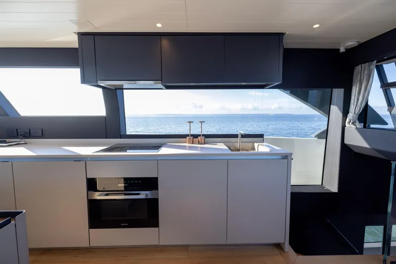Slide: The Image of Modern kitchen interior on 2024 Bluegame BGX63 yacht with ocean view. - 78