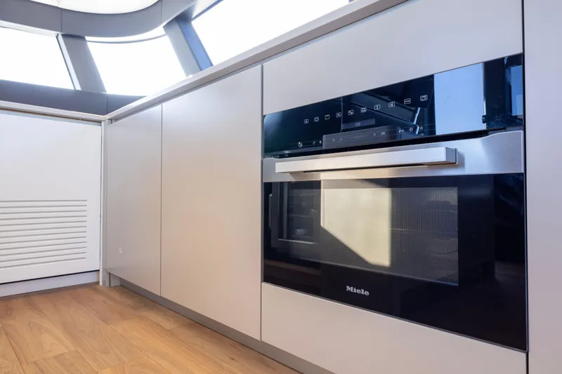 Slide: The Image of Modern kitchen interior on 2024 Bluegame BGX63 yacht with Miele oven. - 80