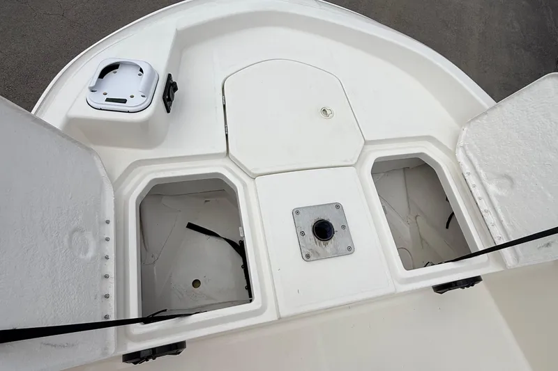 Slide: The Image of 2016 Bayliner Element F18 boat storage compartments and deck view. - 21
