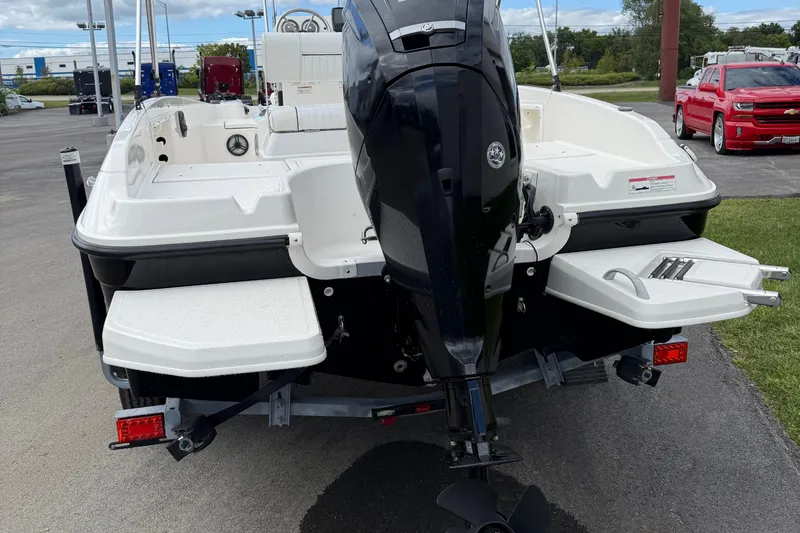 Slide: The Image of 2016 Bayliner Element F18 boat rear view with outboard motor and swim platforms. - 7