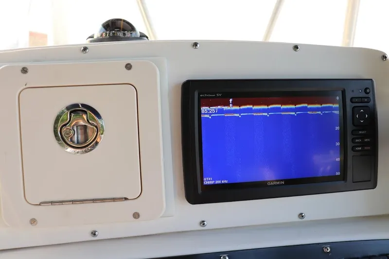 Slide: The Image of Boston Whaler 260 Outrage 2001 dashboard with Garmin fishfinder display. - 13