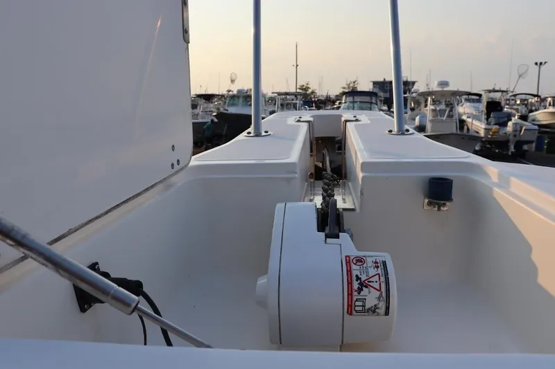 Slide: The Image of 2001 Boston Whaler 260 Outrage boat deck with anchor chain and winch system. - 34