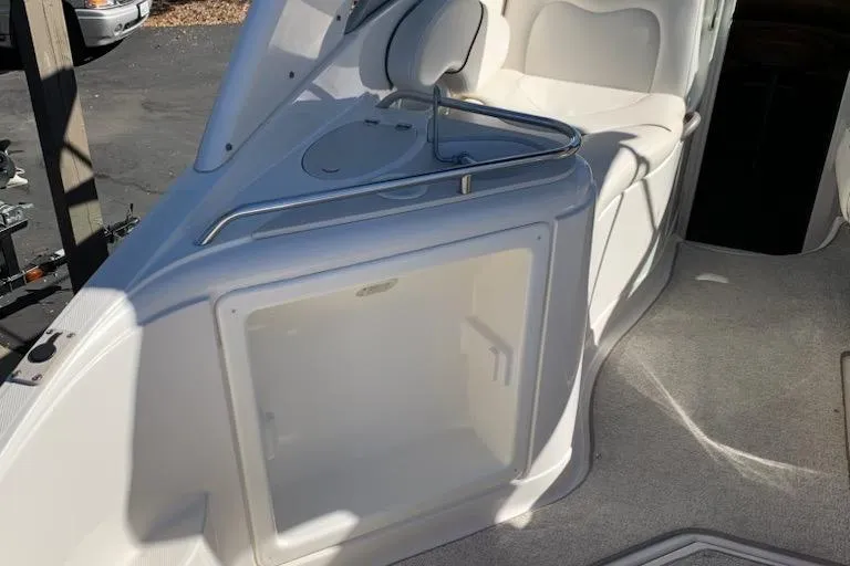 Slide: The Image of 2004 Monterey 265 Cruiser interior with seating and storage area. - 4