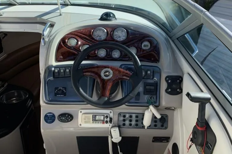 Slide: The Image of 2004 Monterey 265 Cruiser dashboard with steering wheel and control panel. - 5