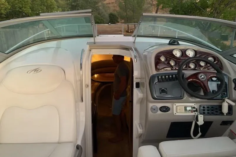 Slide: The Image of 2004 Monterey 265 Cruiser interior with dashboard and cabin entrance. - 6