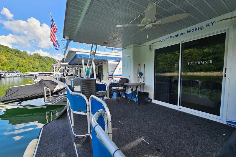 Slide: The Image of 2002 Jamestowner houseboat docked at Port of Marshes Siding, KY, with outdoor seating. - 12