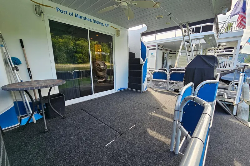 Slide: The Image of 2002 Jamestowner houseboat deck with seating, table, and stairs at Port of Marshes Siding, KY. - 13