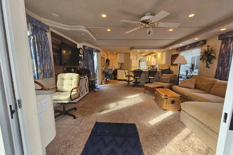 Slide: The Image of Luxurious 2002 Jamestowner houseboat interior with cozy seating, modern kitchen, and elegant decor. - 16