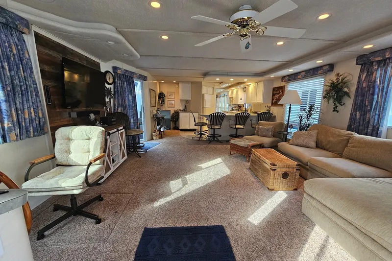 Slide: The Image of Luxurious 2002 Jamestowner houseboat interior with cozy seating, modern kitchen, and elegant decor. - 20
