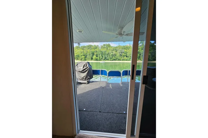 Slide: The Image of 2002 Jamestowner houseboat view through sliding door to deck and scenic lake. - 38
