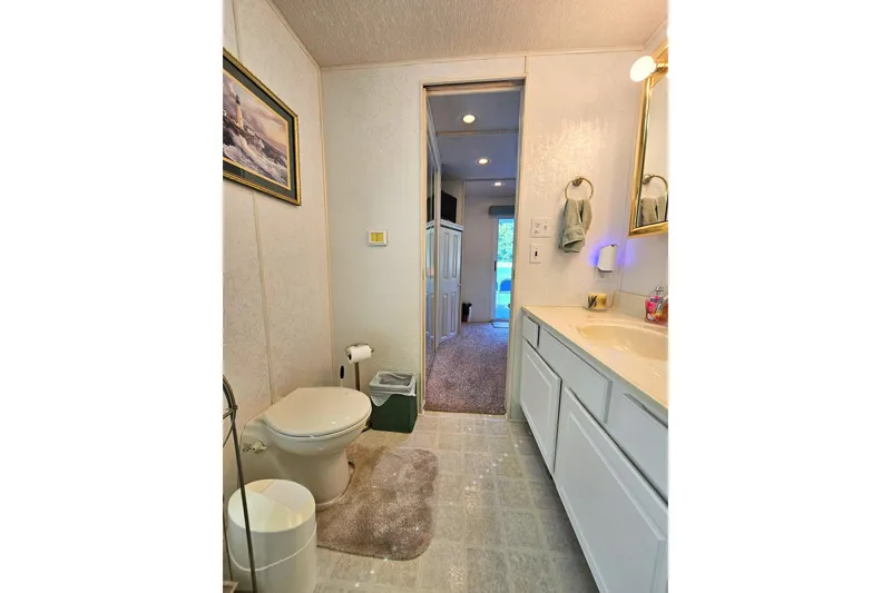 Slide: The Image of Bathroom interior of 2002 Jamestowner houseboat with modern fixtures and decor. - 40
