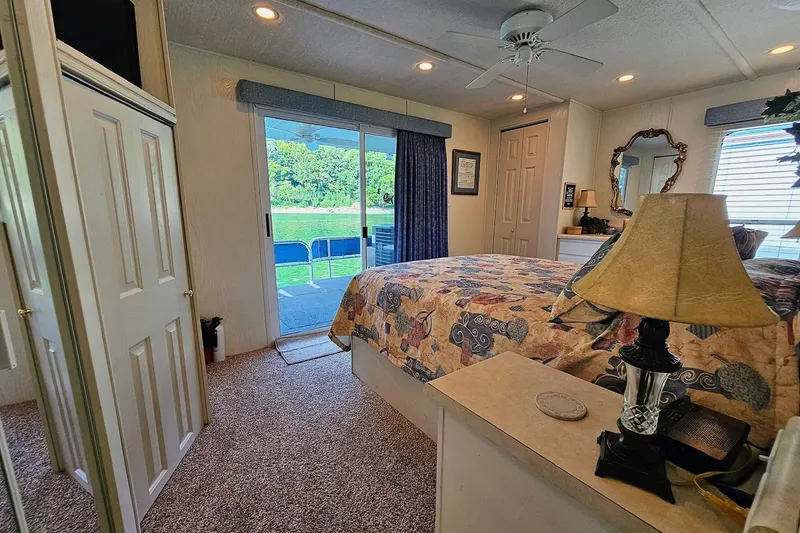 Slide: The Image of Cozy bedroom interior of 2002 Jamestowner houseboat with scenic outdoor view. - 43