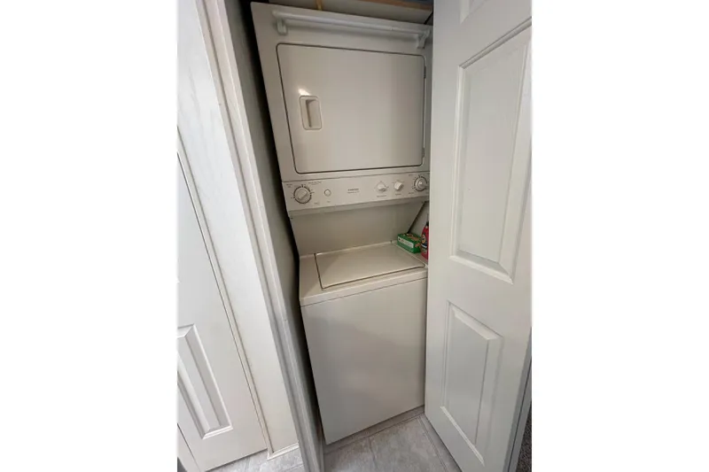 Slide: The Image of Stacked washer and dryer in 2002 Jamestowner houseboat laundry area. - 44