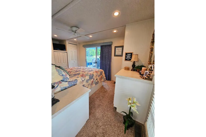 Slide: The Image of Cozy bedroom interior of 2002 Jamestowner houseboat with floral decor and natural light. - 46