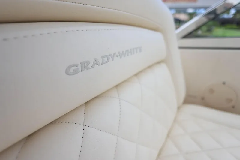 Slide: The Image of Close-up of 2018 Grady-White Freedom 285 boat's luxurious quilted leather seating. - 15