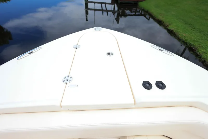 Slide: The Image of Bow of 2018 Grady-White Freedom 285 boat on calm water. - 27