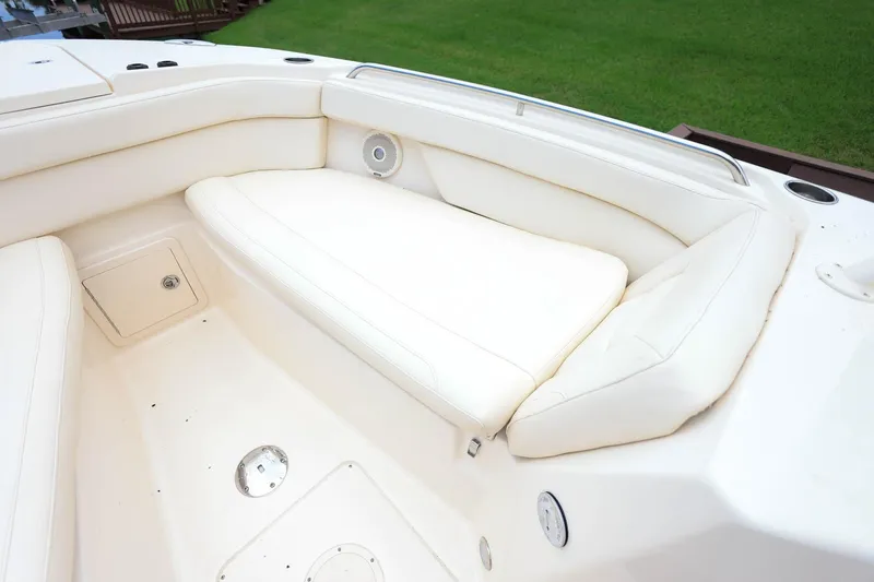 Slide: The Image of 2018 Grady-White Freedom 285 boat interior with white cushioned seating. - 30