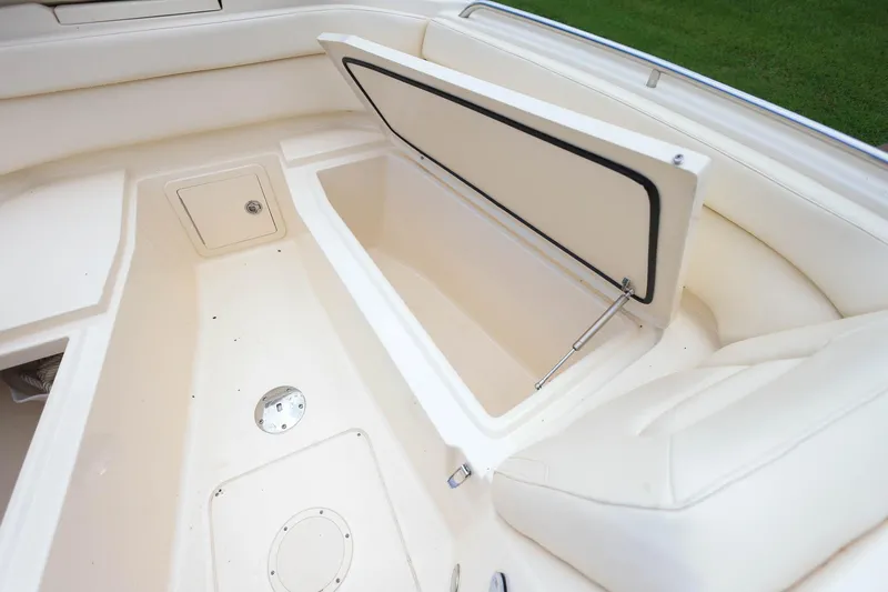 Slide: The Image of 2018 Grady-White Freedom 285 boat interior with open storage compartment. - 31