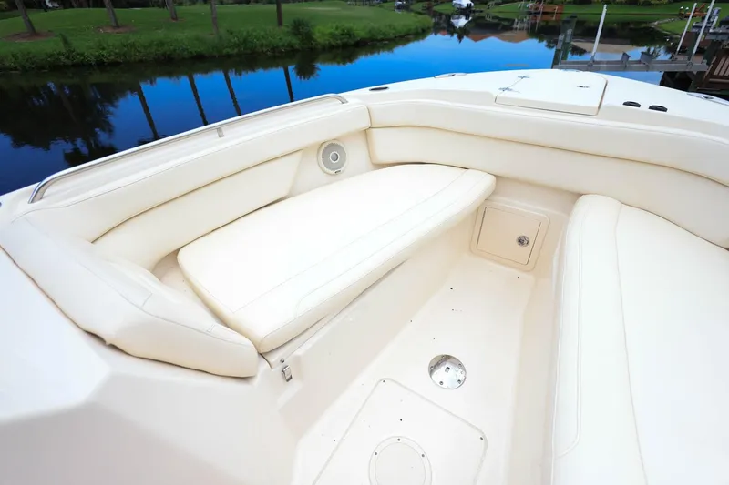 Slide: The Image of 2018 Grady-White Freedom 285 boat interior with white cushioned seating. - 32