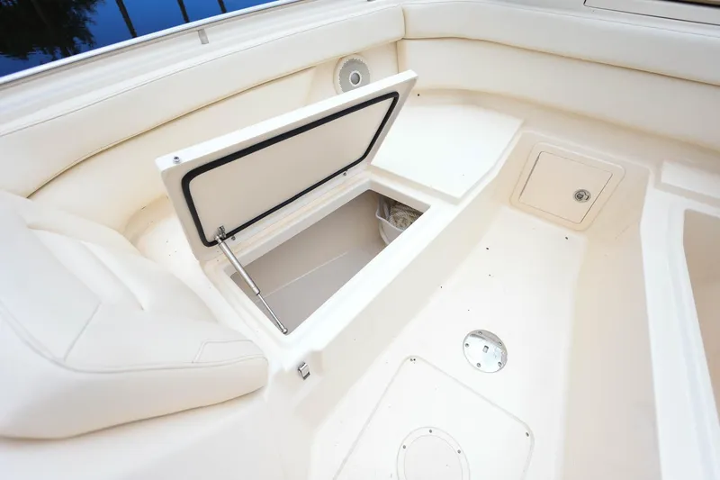 Slide: The Image of 2018 Grady-White Freedom 285 boat interior with open storage compartment. - 33