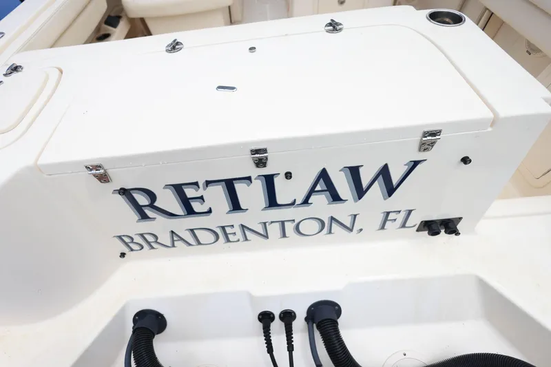 Slide: The Image of 2018 Grady-White Freedom 285 boat with "RETLAW" and "BRADENTON, FL" text on the stern. - 35