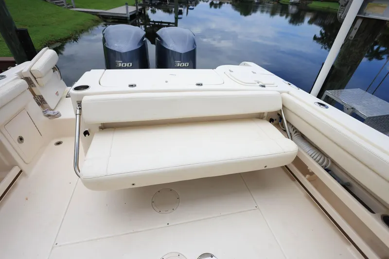 Slide: The Image of 2018 Grady-White Freedom 285 boat with dual engines and foldable seating. - 9