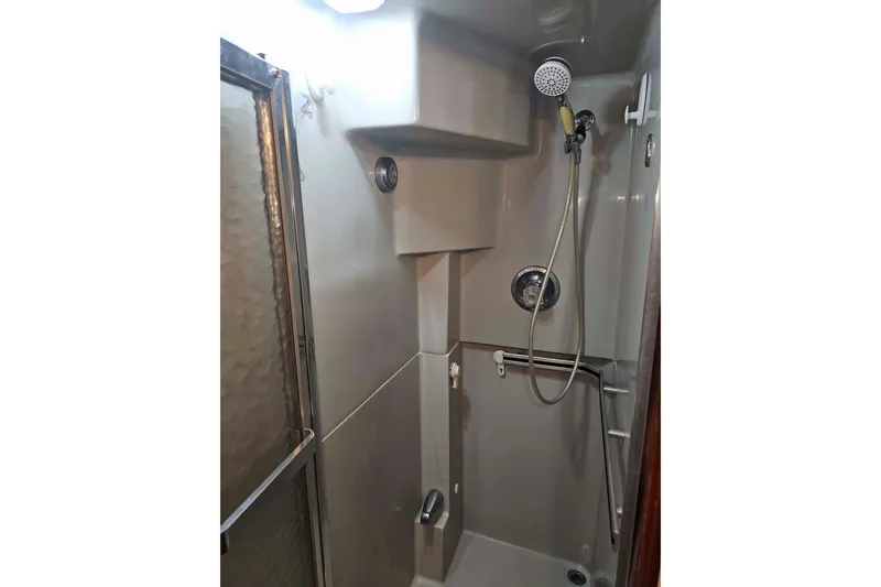 Slide: The Image of Shower area in 1990 Sea Ray 440 Aft Cabin yacht, featuring modern fixtures. - 30