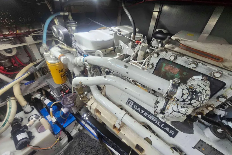 Slide: The Image of Engine room of a 1990 Sea Ray 440 Aft Cabin with Caterpillar components. - 31