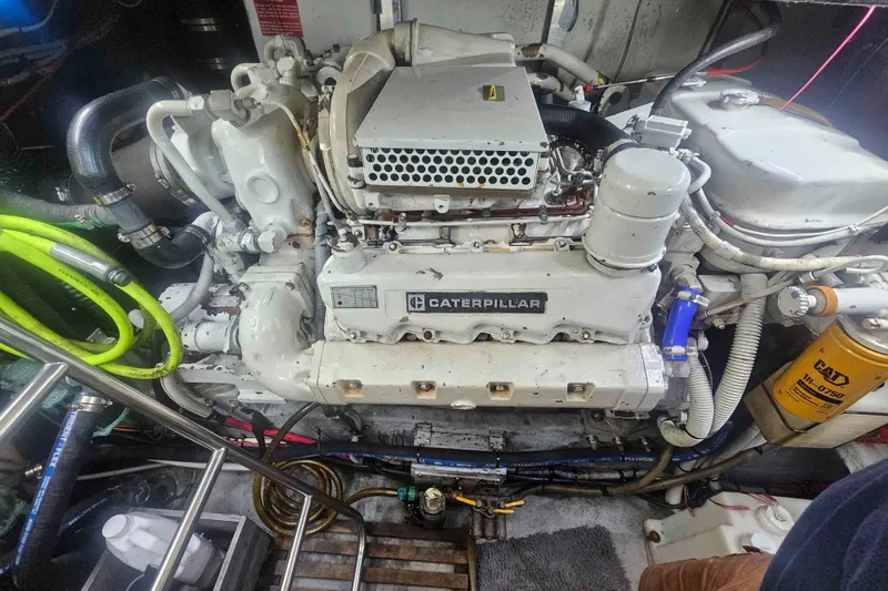 Slide: The Image of Engine room of a 1990 Sea Ray 440 Aft Cabin with Caterpillar engine. - 33