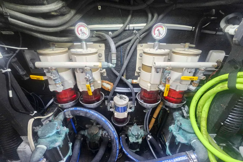 Slide: The Image of Engine room of 1990 Sea Ray 440 Aft Cabin with fuel filters and hoses. - 35