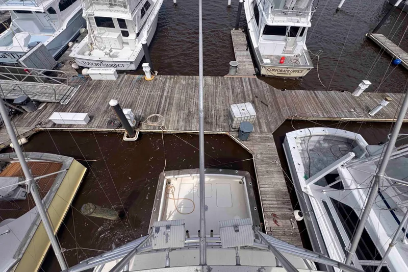 Slide: The Image of Aerial view of 1987 Chris-Craft 422 Commander docked among other boats at a marina. - 14