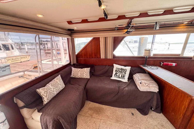Slide: The Image of Interior of 1987 Chris-Craft 422 Commander with cozy seating and nautical decor. - 18