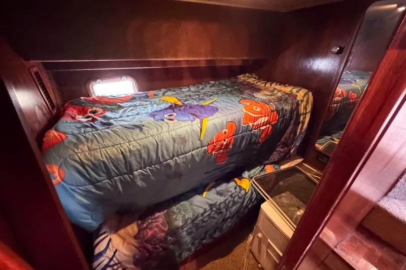 Slide: The Image of Cozy cabin with colorful bedding in 1987 Chris-Craft 422 Commander yacht. - 26