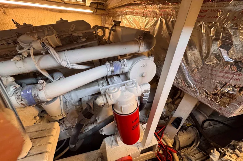 Slide: The Image of Engine room of 1987 Chris-Craft 422 Commander with visible machinery and insulation. - 30
